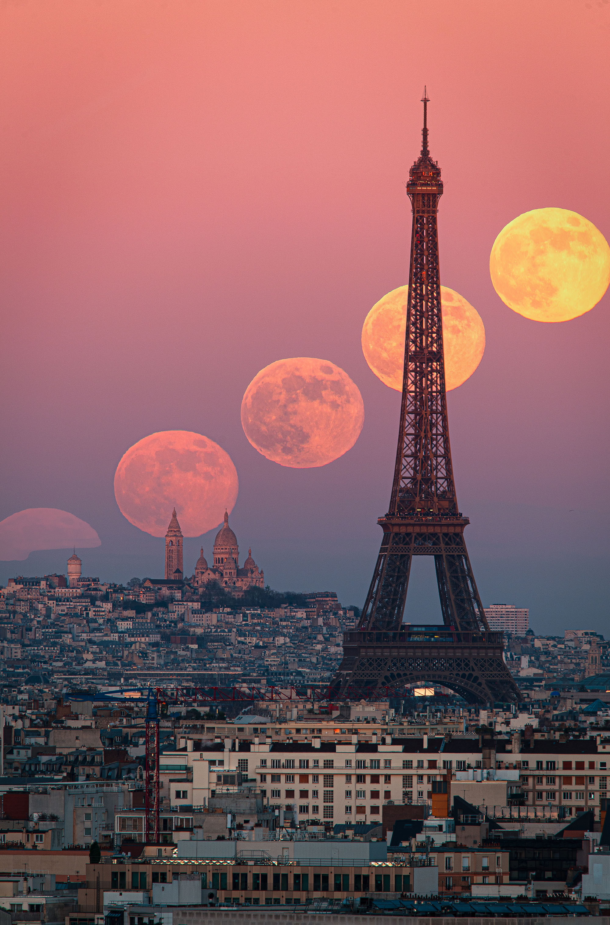 Four supermoon visible in sequence behind the Eiffel tower